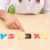 a child playing with alphabet letters spelling out dyslexia