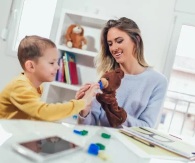 a woman playing with her son