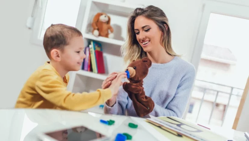 a woman playing with her son