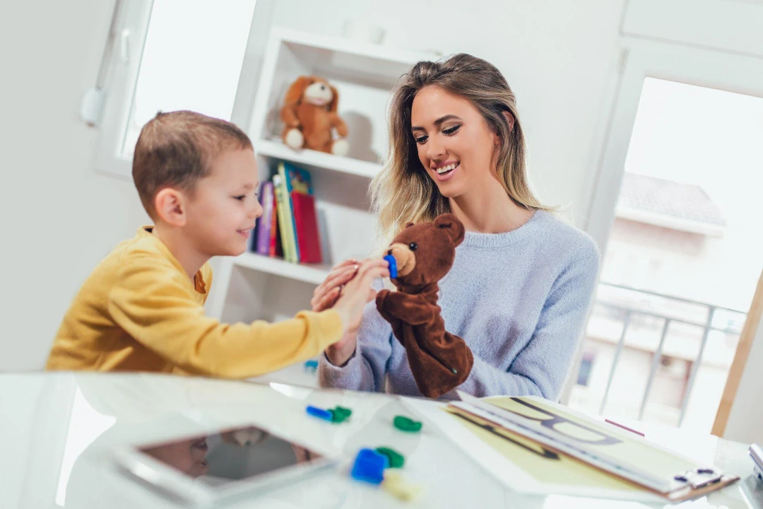 a woman playing with her son