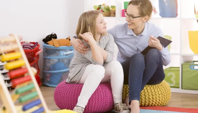 a woman talking to a child